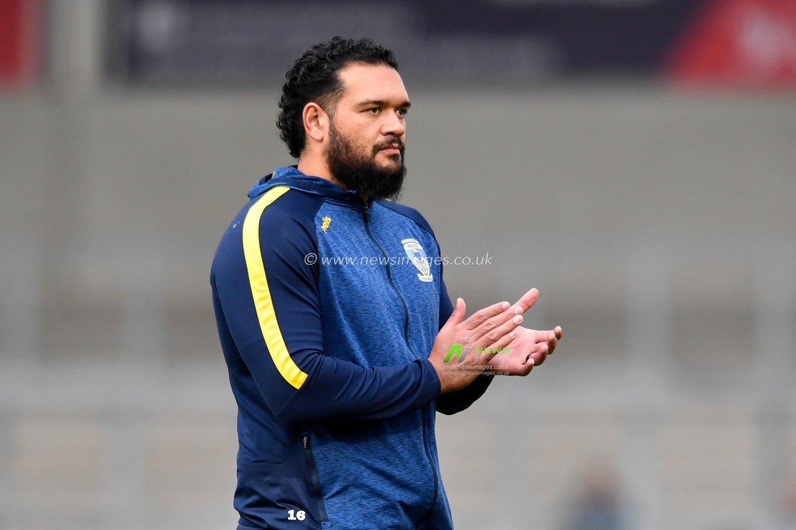 Ben Murdoch-Masila (13) of Warrington Wolves applauds his team during the warm up