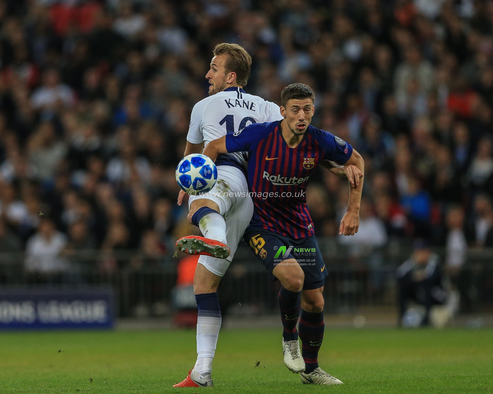 3rd October 2018, Wembley Stadium, London, England; UEFA Champions League, Tottenham v Barcelona ; Harry Kane (10) of Tottenham back tees the ball as Clement Lenglet (15) of Barcelona challenges 

Credit: Mark Cosgrove/News Images