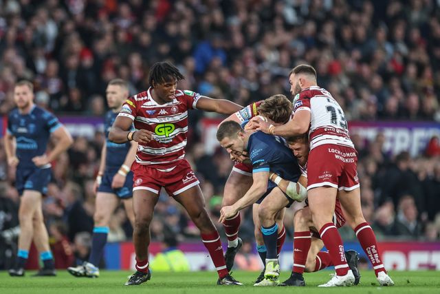 Matt Parcell of Hull KR is tackled by Luke Thompson of Wigan Warriors during the Betfred Super League Grand Final match Wigan Warriors vs Hull KR at Old Trafford, Manchester, United Kingdom, 12th October 2024

(Photo by Mark Cosgrove/News Images)