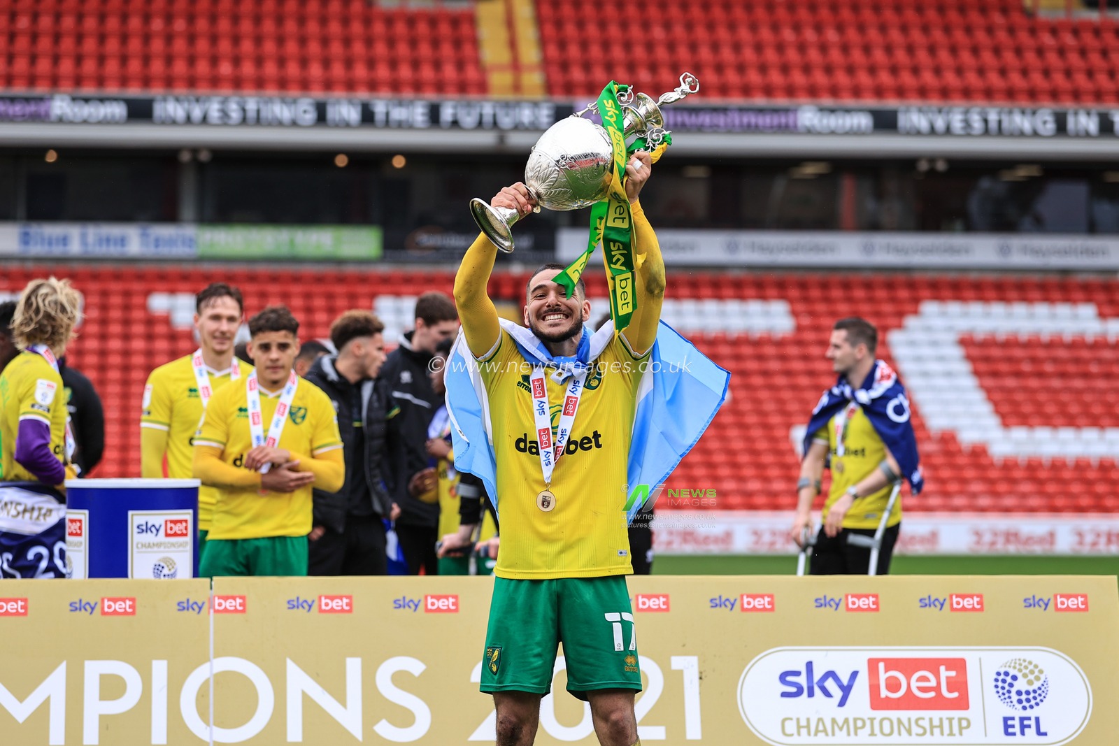 Emi Buendia #17 of Norwich City lifts the Championship trophy