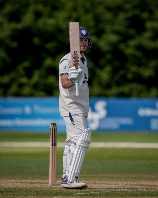 Matthew Montgomery raises his bat to the pavilion to celebrate scoring a fifty during the county Championship Division Two day 4 Derbyshire vs Gloucestershire at The Central Co-Op County Ground, Derby, United Kingdom on 27 April 2026

(Photo by Maynard Manyowa/News Images)