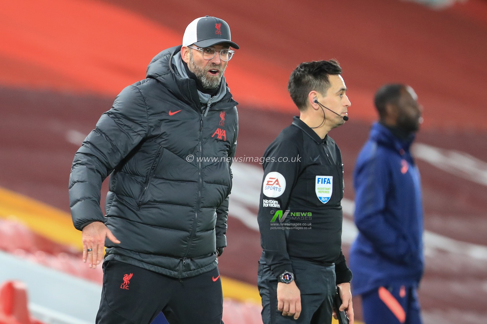 JÃ¼rgen Klopp manager of Liverpool reacts with the line official