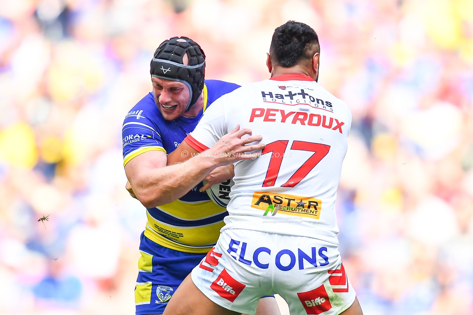 24th August 2019 , Wembley Stadium, London England ; 2019 Coral Challenge Cup Final ; St Helens vs Warrington Wolves ; Chris Hill of Warrington Wolves is tackled by Dominique Peryoux (17) of St Helens 



Credit: Craig Thomas/News Images