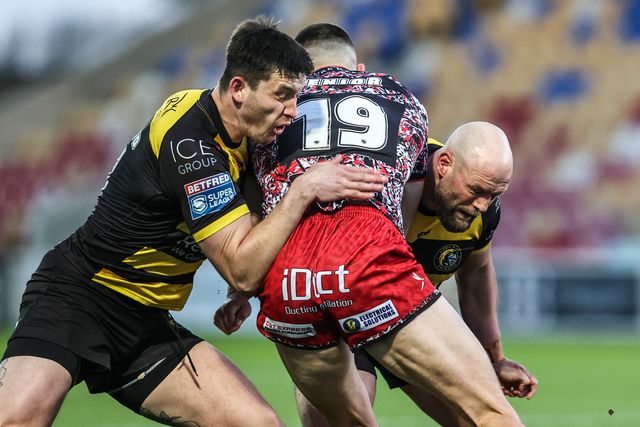 Innes Senior of Leigh Leopards is tackled by Sam Wood of York Knights and Paul McShane of York Knights during the Betfred Super League round 8 match York Knights vs Leigh Leopards at LNER Community Stadium, York, United Kingdom on 17 April 2026

(Photo by Alfie Cosgrove/News Images)