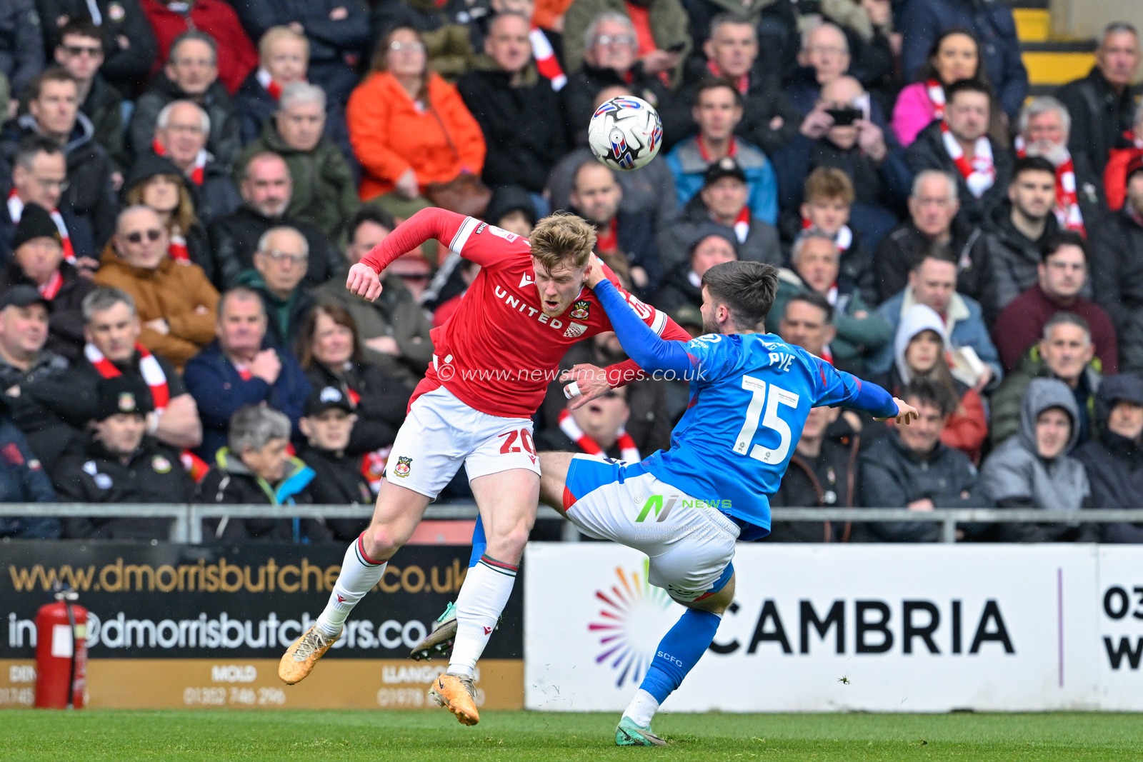 Andy Cannon of Wrexham and Ethan Pye of Stockport County  battle for the ball, during the Sky Bet League 2 match Wrexham vs Stockport County at SToK Cae Ras, Wrexham, United Kingdom, 27th April 2024

(Photo by Cody Froggatt/News Images)