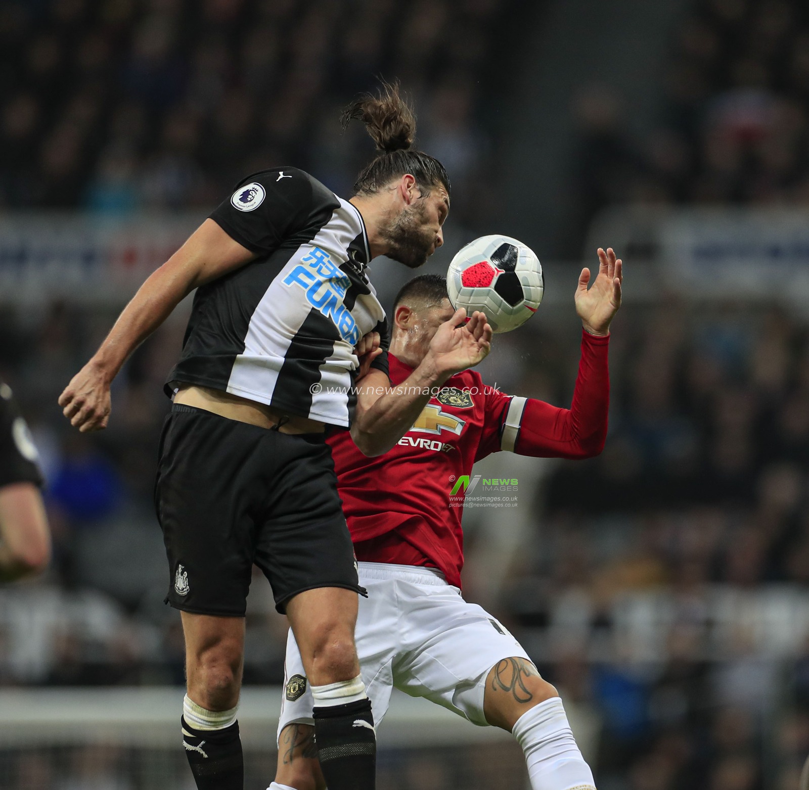 6th October 2019, St. James's Park, Newcastle, England; Premier League, Newcastle United v Manchester United : Andy Carroll (7) of Newcastle United wins the header

Credit: Conor Molloy/News Images