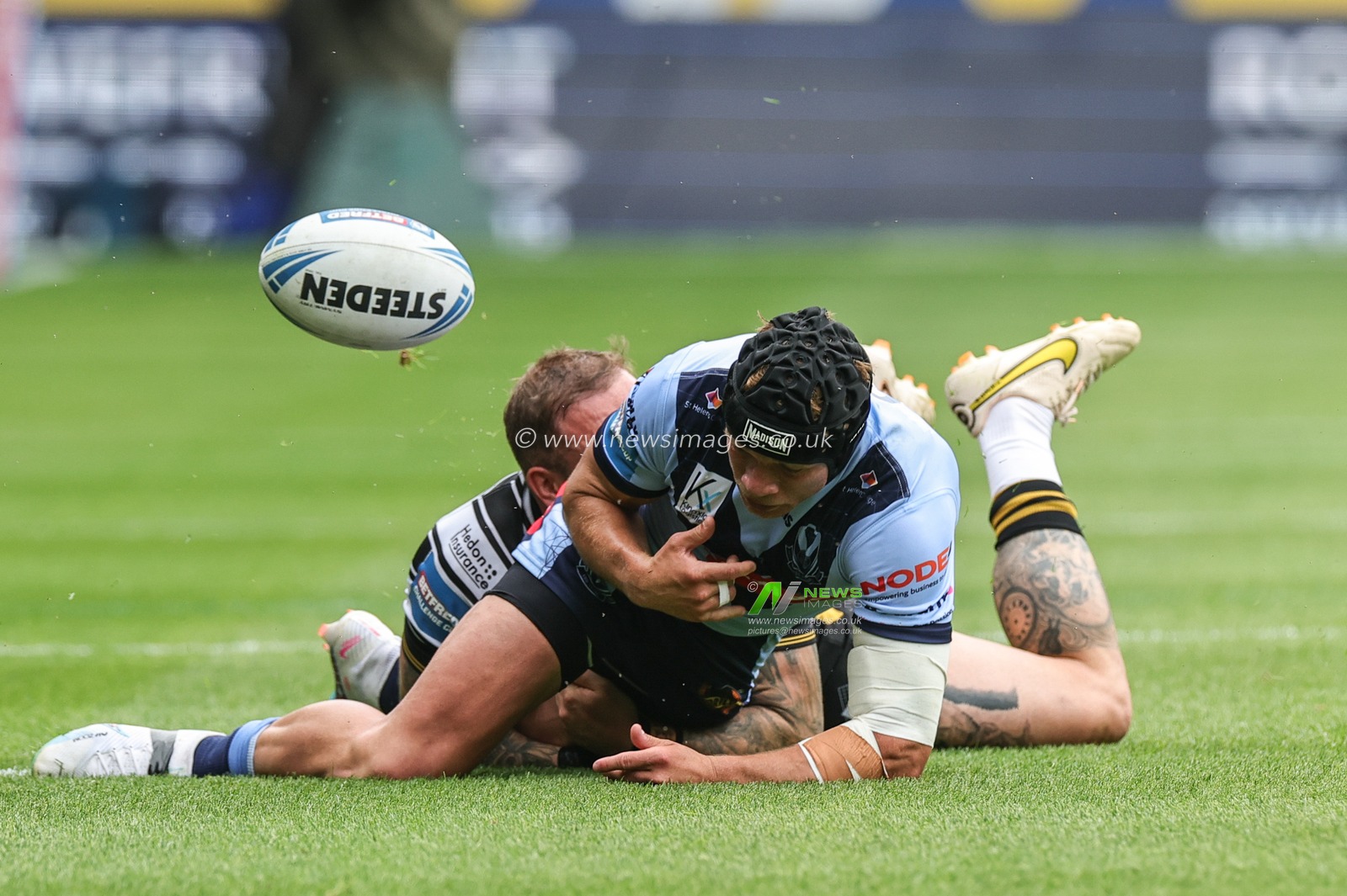 Josh Griffin #23 of Hull FC forces Jonny Lomax #6 of St Helens to drop the ball during the Betfred Challenge Cup match Hull FC vs St Helens at MKM Stadium, Hull, United Kingdom, 17th June 2023

(Photo by Mark Cosgrove/News Images)