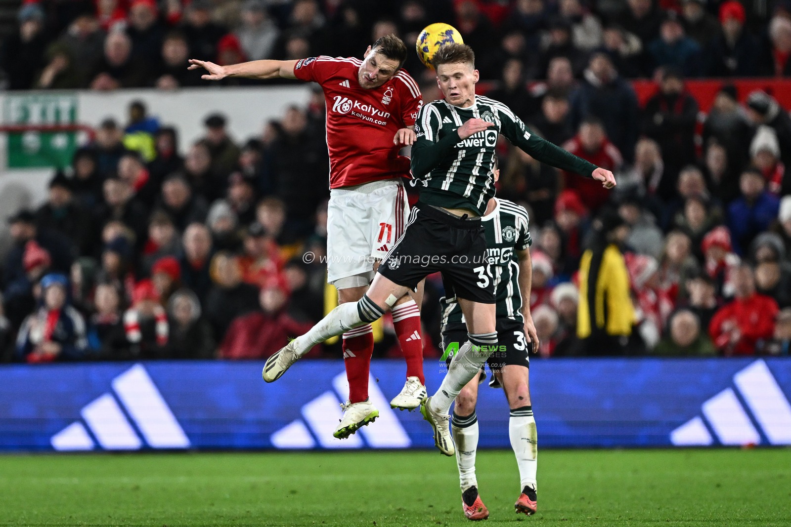 Scott McTominay of Manchester United and Chris Wood of Nottingham Forest battle for the ball during the Premier League match Nottingham Forest vs Manchester United at City Ground, Nottingham, United Kingdom, 30th December 2023

(Photo by Craig Thomas/News Images)