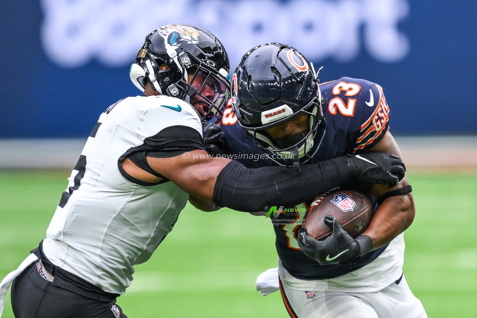 Roschon Johnson of the Chicago Bears is tackled by Andre Cisco of the Jacksonville Jaguars during the Week 6 match Chicago Bears vs Jacksonville Jaguars at Tottenham Hotspur Stadium, London, United Kingdom, 13th October 2024

(Photo by Craig Thomas/News Images)