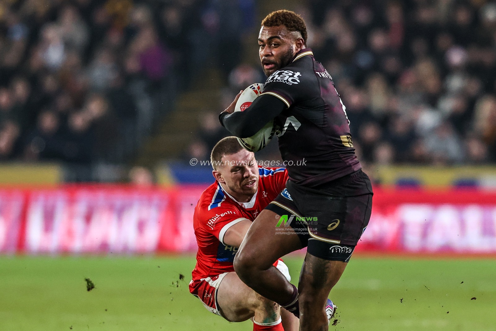 Jaiyden Hunt of Brisbane Broncos avoids a tackle from James Batchelor of Hull KR during the World Club Challenge 2026 match Hull KR vs Brisbane Broncos at MKM Stadium, Hull, United Kingdom on 19 February 2026

(Photo by Alfie Cosgrove/News Images)
