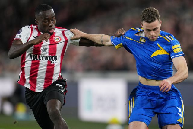 Gabriel Gudmundsson of Leeds United and Michael Kayode of Brentford during the Premier League match Brentford vs Leeds United at The Gtech Community Stadium, London, United Kingdom, 14th December 2025

(Photo by Harvey Murphy/News Images)

*** GER AUT SUI OUT ***