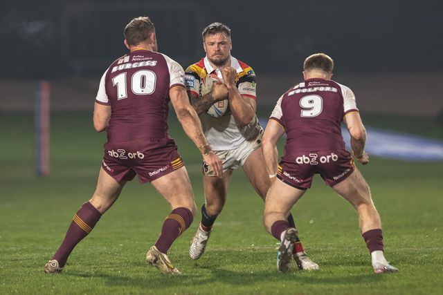 Ryan Sutton of Bradford Bulls looks for a way past Tom Burgess of Huddersfield Giants and Zac Woolford of Huddersfield Giants during the Betfred Super League Round 5 match Bradford Bulls vs Huddersfield Giants at Odsal Stadium, Bradford, United Kingdom on 20 March 2026

(Photo by Mark Cosgrove/News Images)