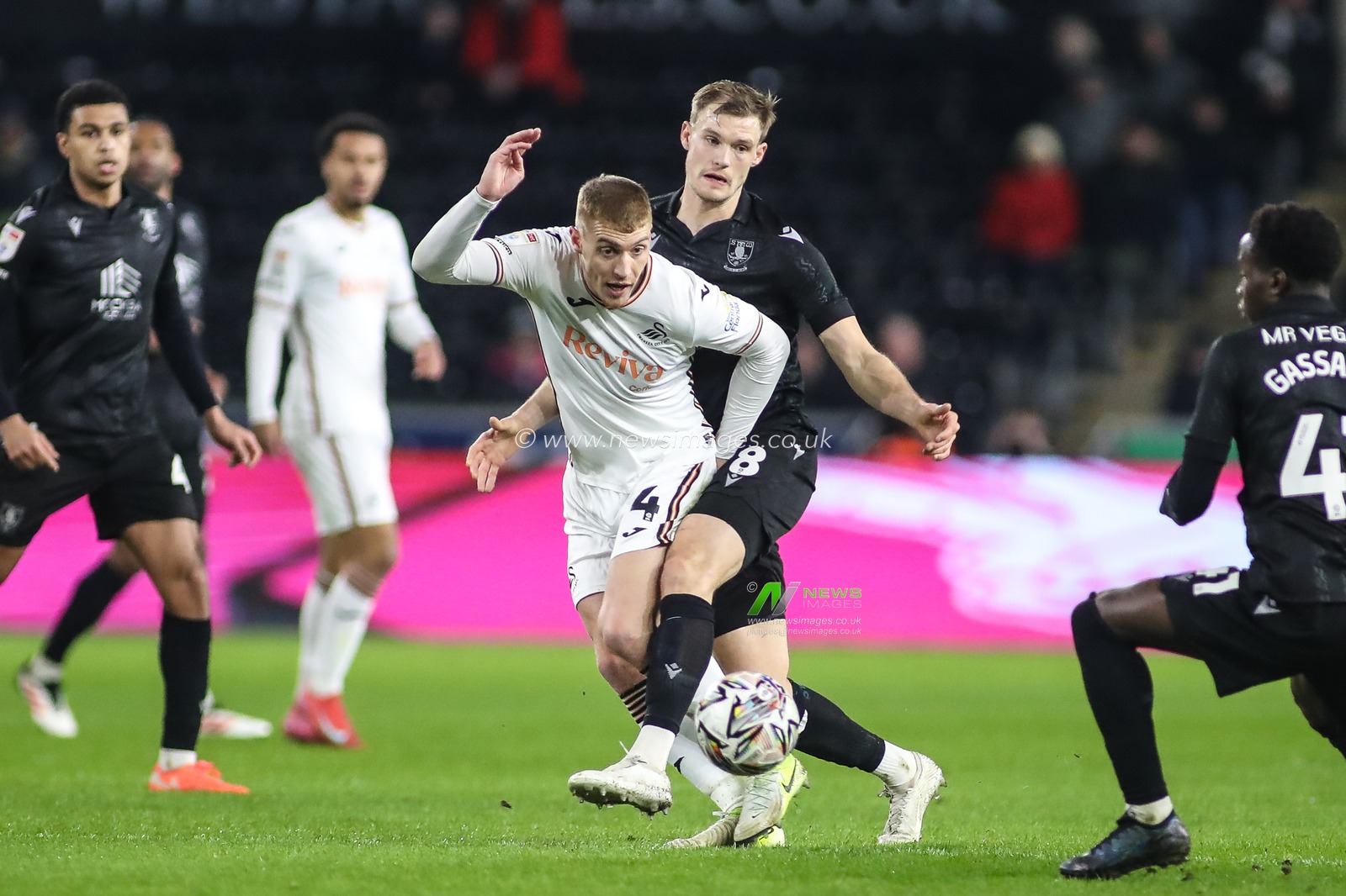 Jay Fulton of Swansea City under pressure from Svante Ingelsson of Sheffield Wednesday during the Sky Bet Championship match Swansea City vs Sheffield Wednesday at Swansea.com Stadium, Swansea, United Kingdom, 12th February 2025

(Photo by Andrew Lewis/News Images)