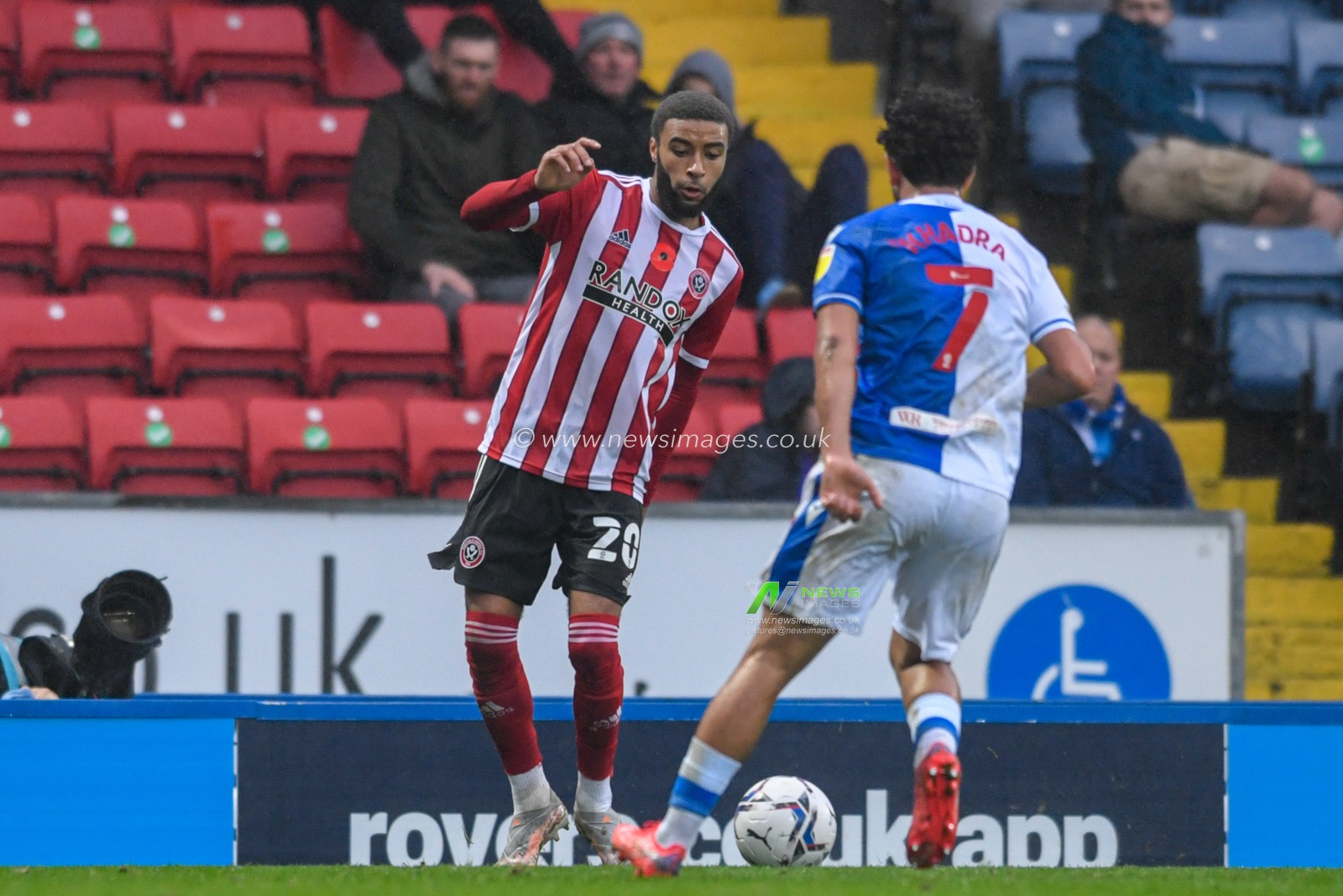 Jayden Bogle #20 of Sheffield United looks for a way past Reda Khadra #7 of Blackburn Rovers