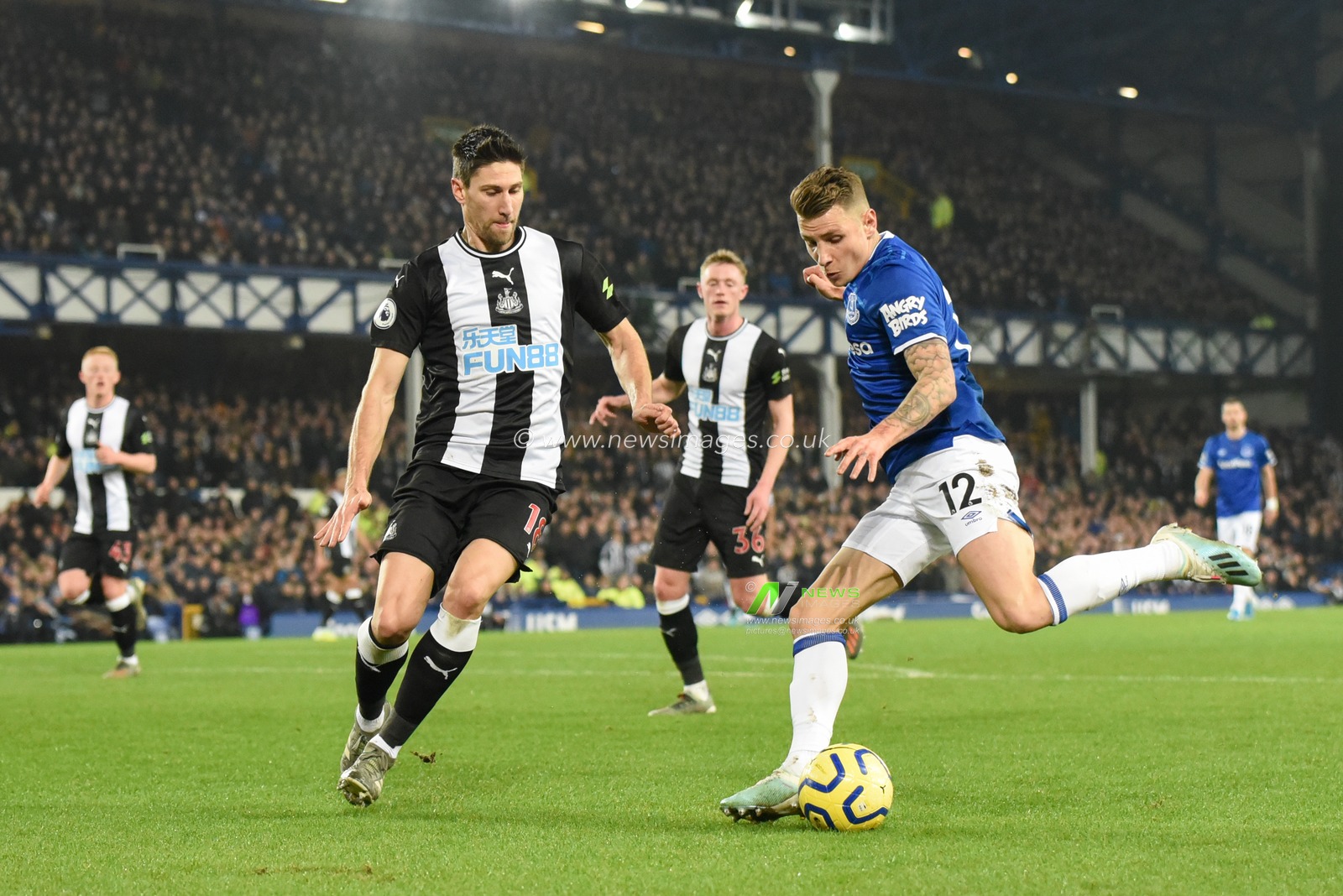 21st January 2020, Goodison Park, Liverpool, England; Premier League, Everton v Newcastle United : Lucas Digne (12) of Everton attempts to cross the ball while Federico Fernandez (18) of Newcastle United closes him down