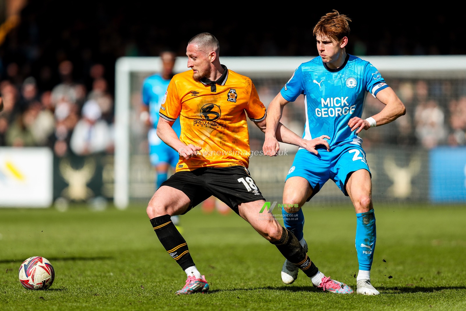 Ryan Loft of Cambridge United is put under pressure by Hector Kyprianou of Peterborough United during the Sky Bet League 1 match Cambridge United vs Peterborough United at Cledara Abbey Stadium, Cambridge, United Kingdom, 15th March 2025

(Photo by Izzy Poles/News Images)