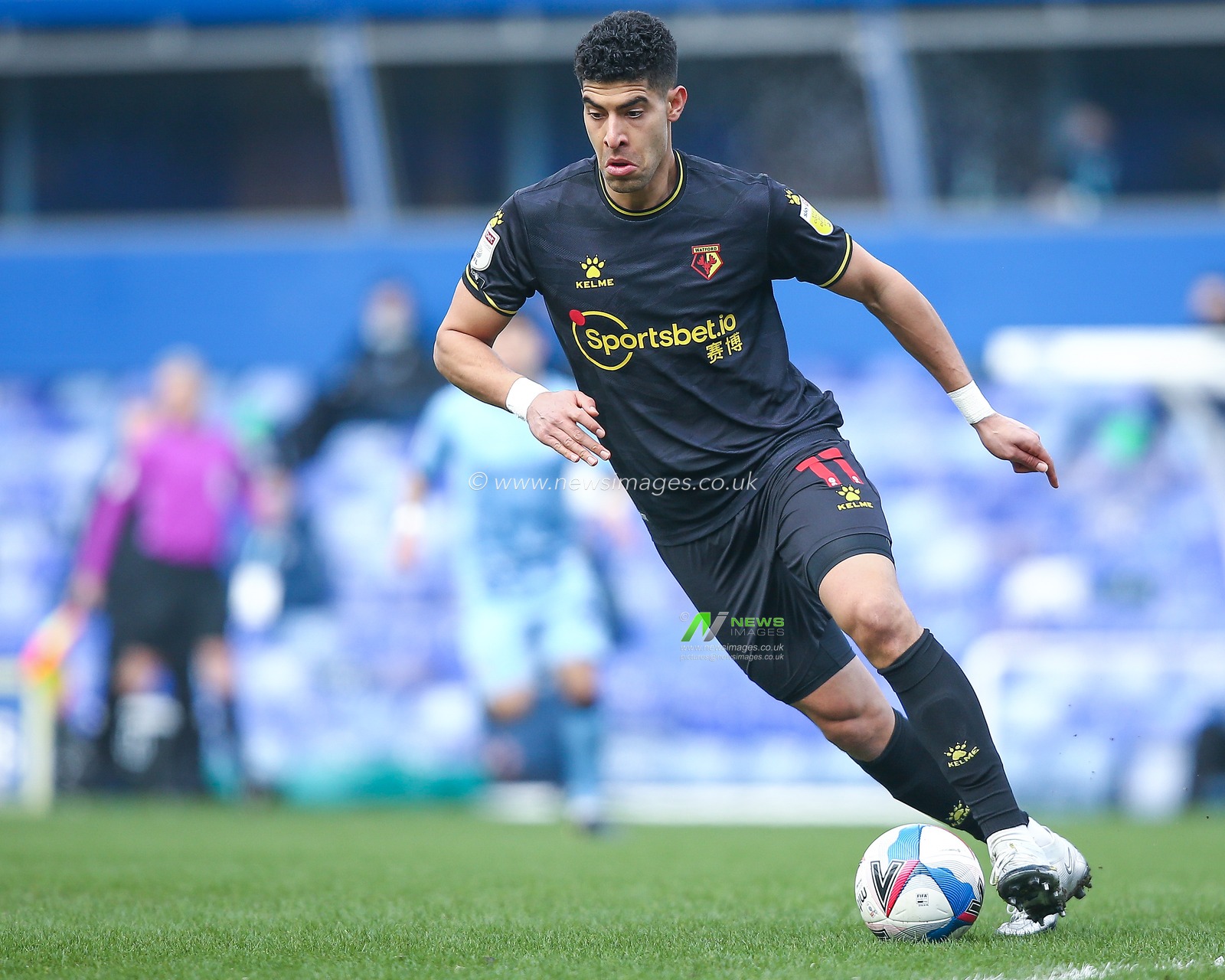 Adam Masina #11 of Watford dribbles the ball