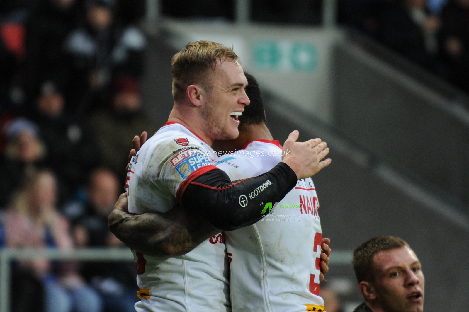 19th January 2019 , Totally Wicked Stadium, St Helens, England;  Betfred Super League Warm Up and Jonny Lomax Testimonial ,  St Helens v Hull FC ; Adam Swift of St Helens celebrates his try with Kevin Naiqama 


Credit: Richard Long/News Images