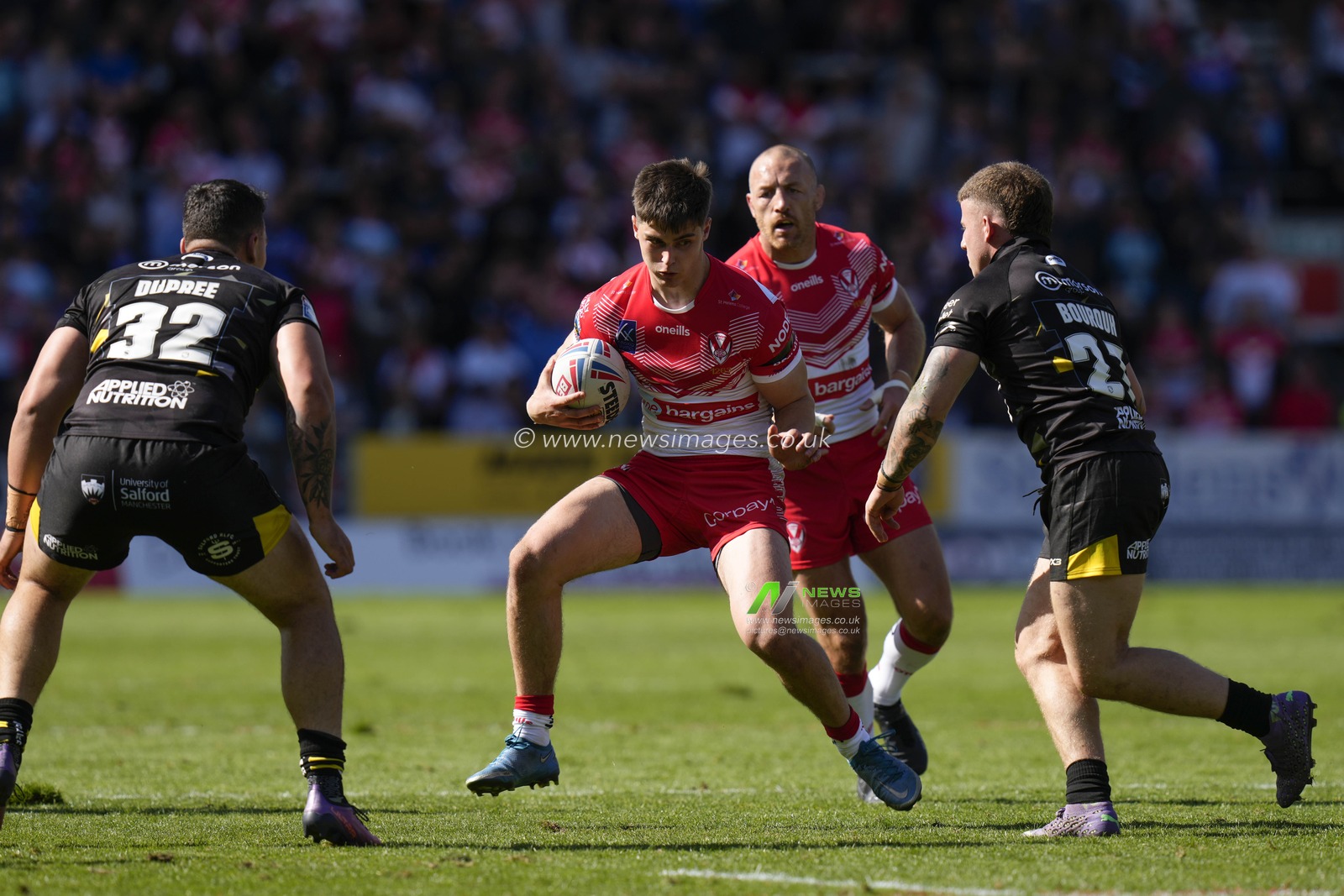 Joe Bennison #27 of St Helens runs at the Salford Red Devils defence during the Betfred Super League match St Helens vs Salford Red Devils at Totally Wicked Stadium, St Helens, United Kingdom, 17th September 2022

(Photo by Steve Flynn/News Images)
