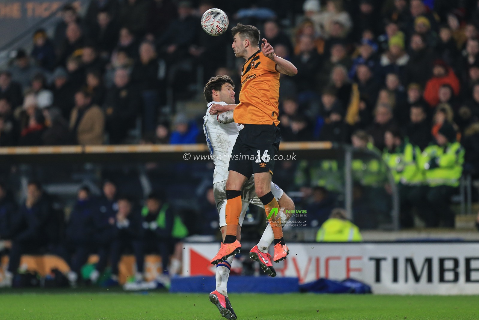 25th January 2020, KC Stadium, Kingston upon Hull, England; Emirates FA Cup, Hull City v Chelsea : Robbie McKenzie (16) of Hull City gets to the ball first ahead of Marcos Alonso (3) of Chelsea