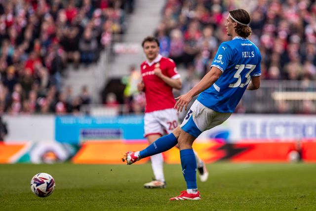 Stockport County's Brad Hills passes the ball during the Sky Bet League 1 match Wrexham vs Stockport County at SToK Cae Ras, Wrexham, United Kingdom, 22nd March 2025

(Photo by Nik Mesney/News Images)