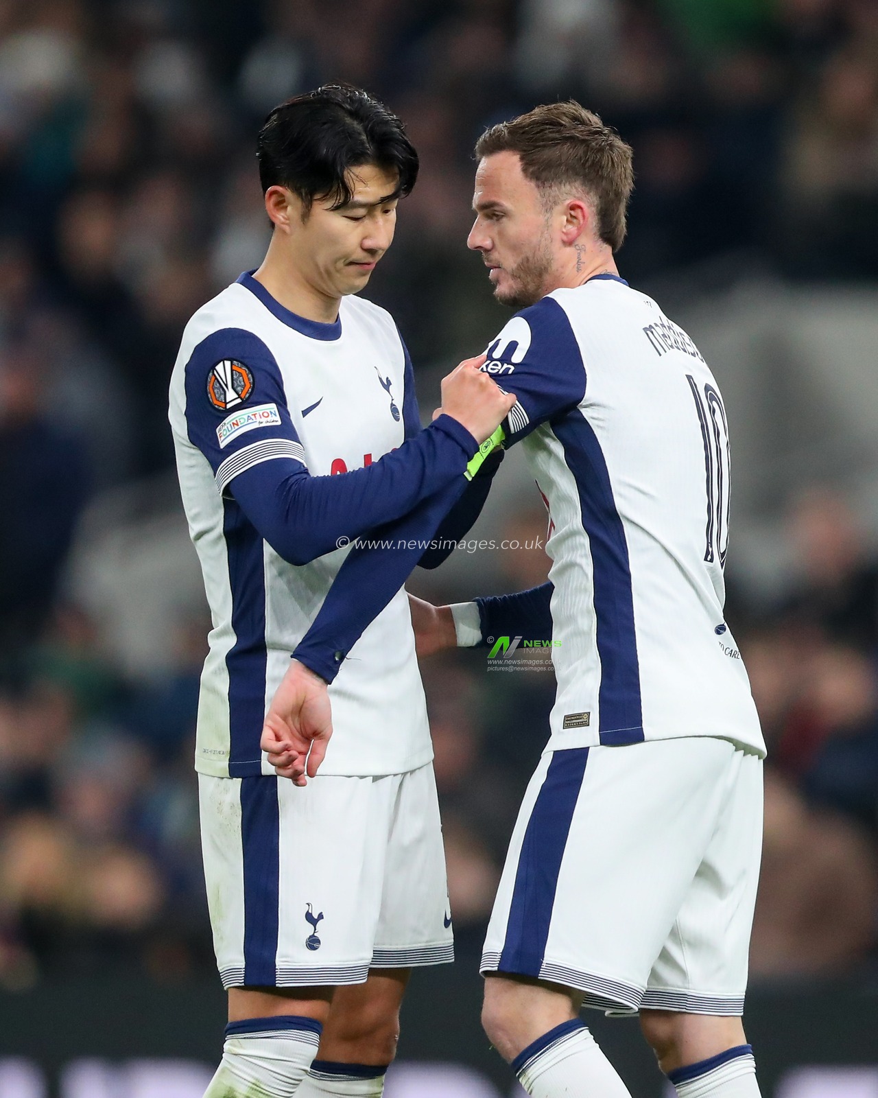 Son Heung-Min of Tottenham Hotspur puts the captains armband on James Maddison of Tottenham Hotspur during the UEFA Europa League - League Stage match Tottenham Hotspur vs A.S. Roma at Tottenham Hotspur Stadium, London, United Kingdom, 28th November 2024

(Photo by Gareth Evans/News Images)