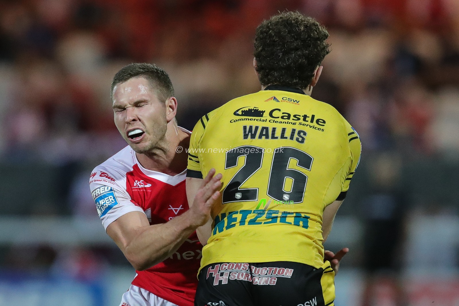 Elliot Wallis #26 of Castleford Tigers is tackled by Matt Parcell #9 of Hull KR during the Betfred Super League Round 20 match Hull KR vs Castleford Tigers at Sewell Group Craven Park, Kingston upon Hull, United Kingdom, 28th July 2023

(Photo by James Heaton/News Images)