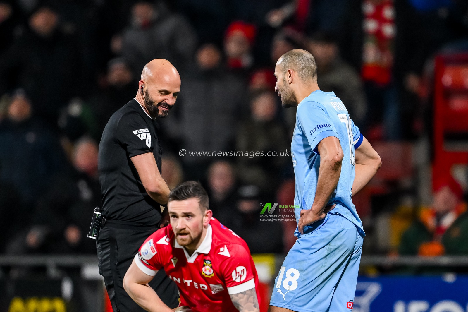 Referee Darren Drysdale gives a red card to Darren Pratley of Leyton Orient during the Sky Bet League 1 match Wrexham vs Leyton Orient at SToK Cae Ras, Wrexham, United Kingdom, 18th February 2025

(Photo by Craig Thomas/News Images)