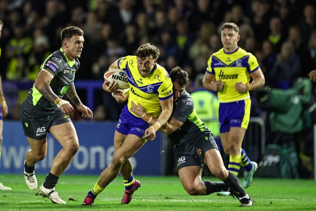 Matty Ashton of Warrington Wolves is tackled by â€˜Benjamin Garcia of Catalan Dragons during the Betfred Super League Round 2 match Warrington Wolves vs Catalans Dragons at Luke Littler Stadium, Warrington, United Kingdom, 21st February 2025

(Photo by Mark Cosgrove/News Images)