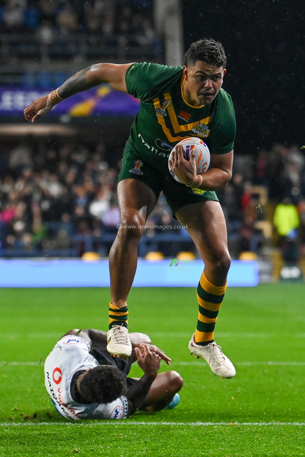 Latrell Mitchell of Australia breaks the tackled by Kevin Naiqama of Fiji during the Rugby League World Cup 2021 match Australia vs Fiji at Headingley Stadium, Leeds, United Kingdom, 15th October 2022

(Photo by Craig Thomas/News Images)
