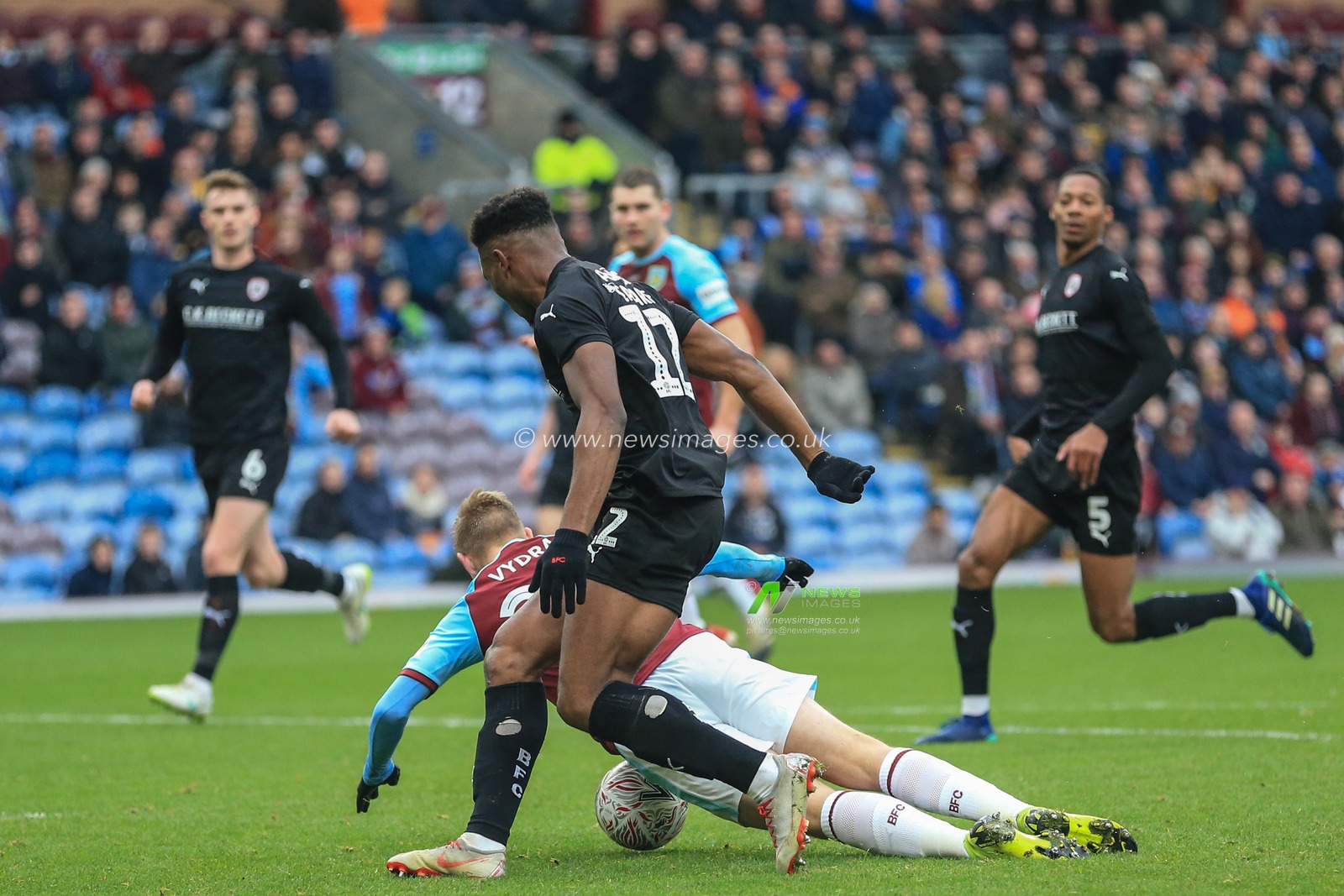5th January 2019, Turf Moor, Burnley, England ; The Emirates FA Cup, 3rd Round, Burnley vs Barnsley : Dimitri Cavare (12) of Barnsley appears to bring dons Matej Vydra of Burnley in the area referee Simon Hooper gives a penalty but is over ruled by VAR 

Credit: Mark Cosgrove/News Images

English Football League images are subject to DataCo Licence