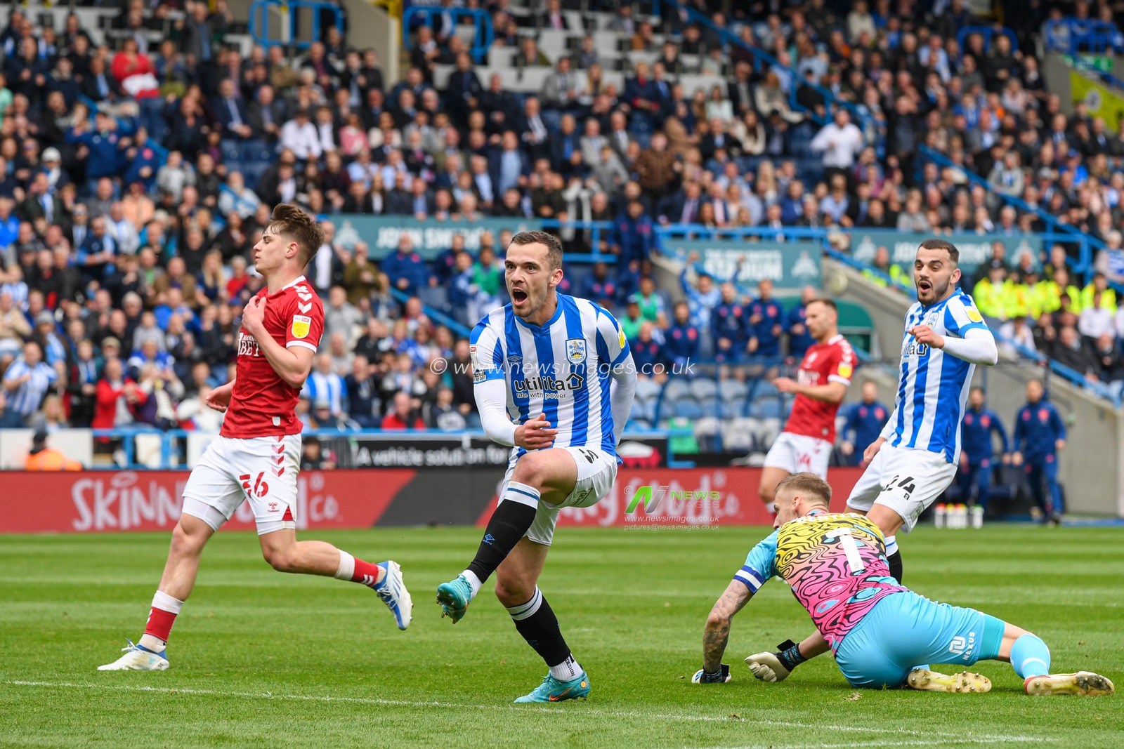 Harry Toffolo #3 of Huddersfield Town celebrates scoring a goal to make it 1-0