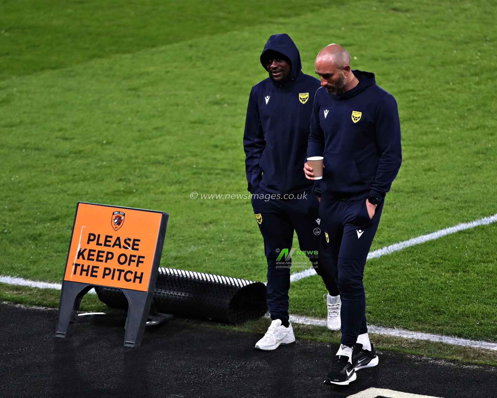 Alex Matos of Oxford United and an Oxford staff member before the Sky Bet Championship match Hull City vs Oxford United at MKM Stadium, Hull, United Kingdom, 12th March 2025

(Photo by Sam Eaden/News Images)