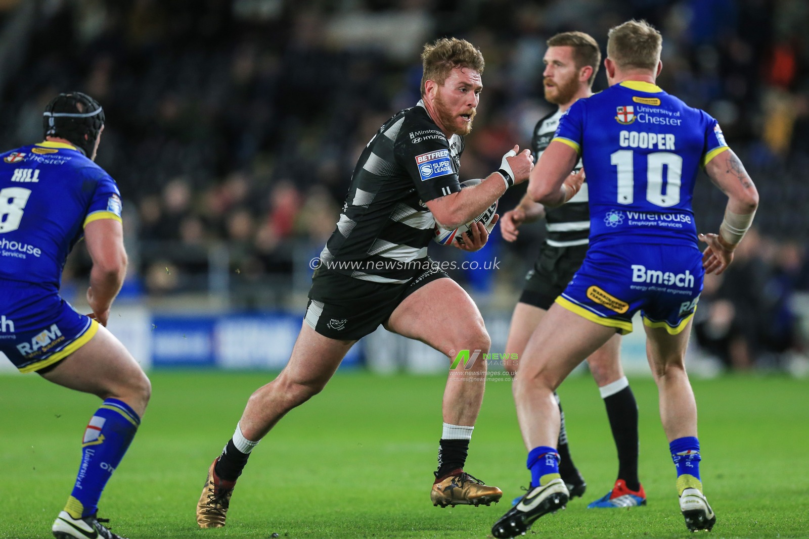 12th March 2020, KCOM Stadium, Hull, England; Betfred Super League, Hull FC v Warrington Wolves : Scott Taylor (8) of Hull FC runs at Mike Cooper (10) of Warrington Wolves