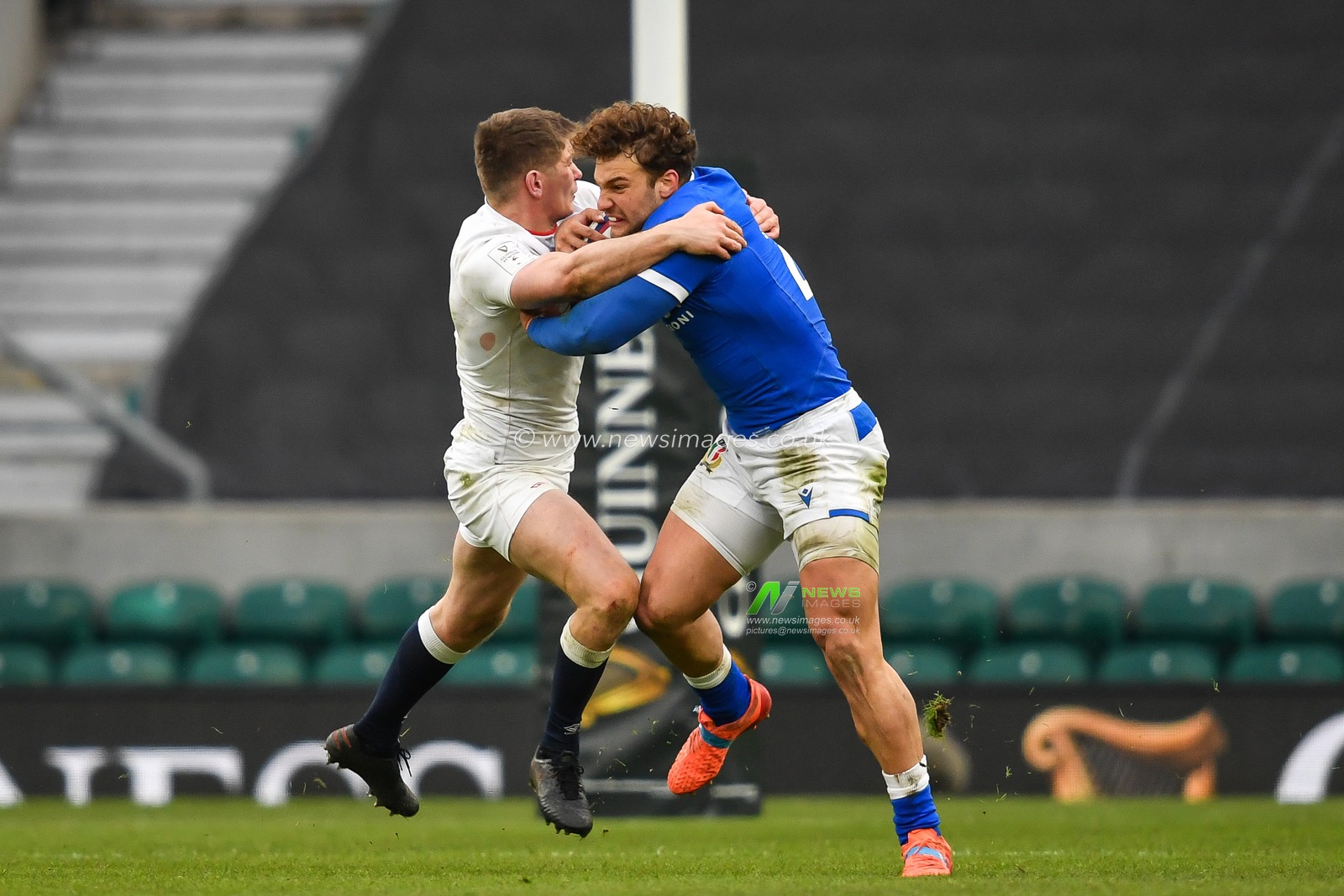 Federico Mori of Italy is tackled by Owen Farrell of England