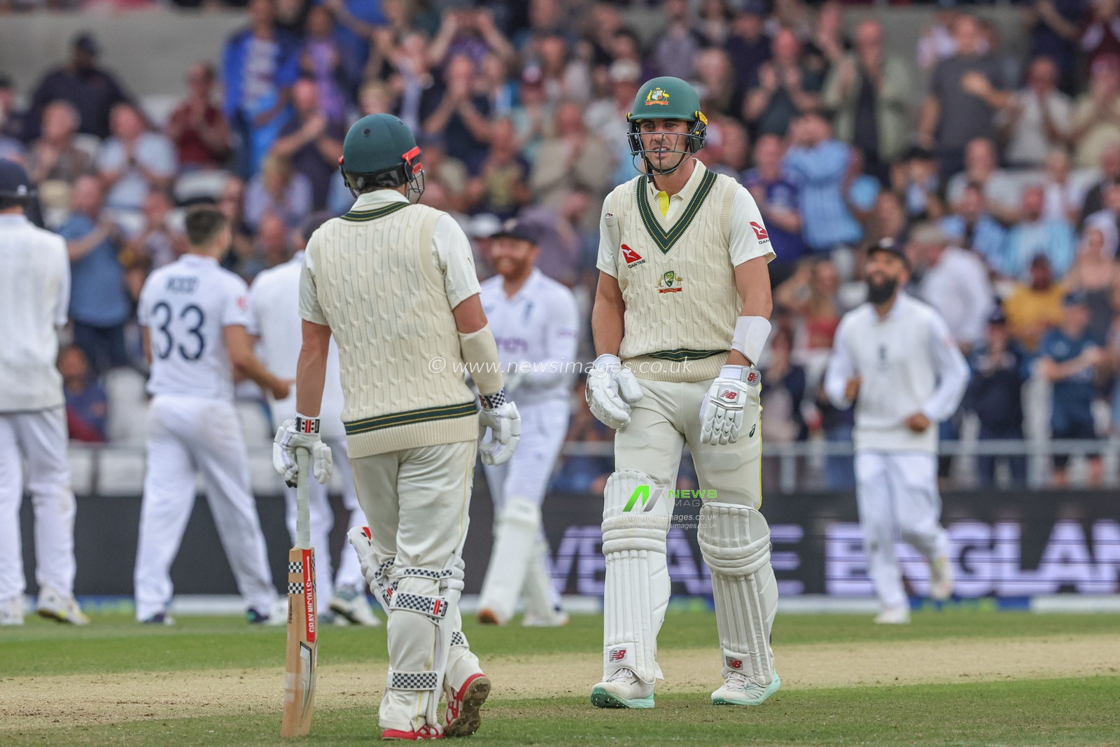 Pat Cummings of Australia speaks to Travis Head of Australia as they review his wicket however is ruled out during the LV= Insurance Ashes Third Test Series Day 3 England v Australia at Headingley Stadium, Leeds, United Kingdom, 8th July 2023

(Photo by Mark Cosgrove/News Images)