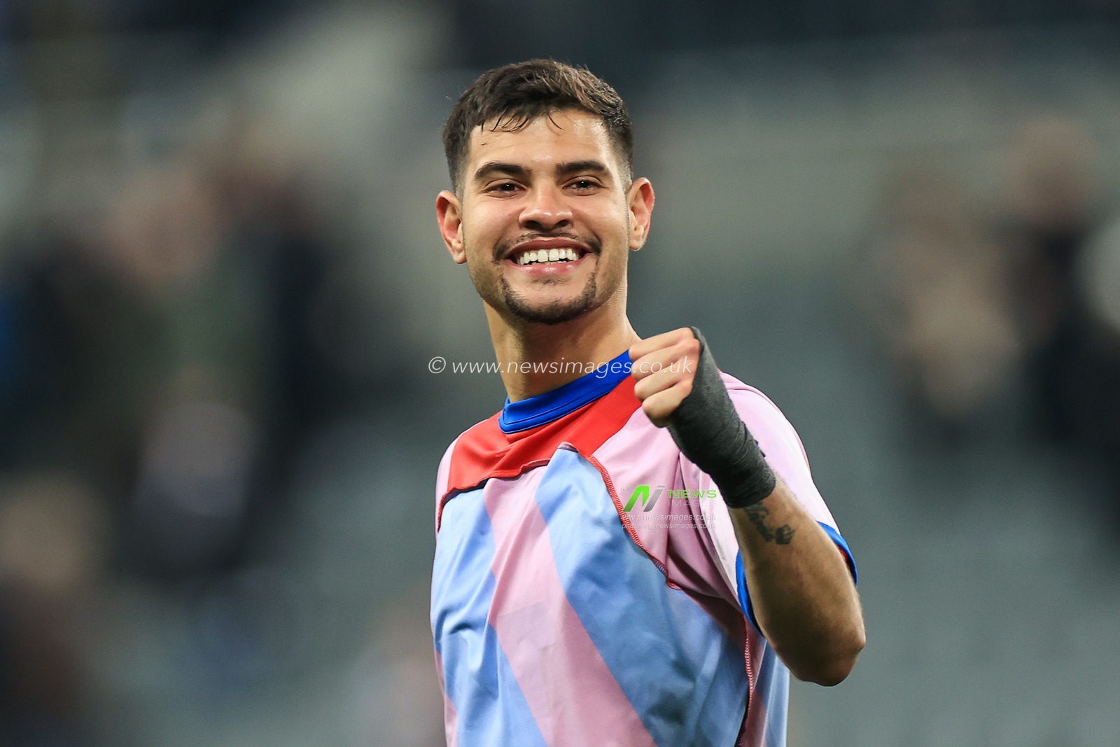 Bruno Guimaraes #39 of Newcastle United celebrates with the fans