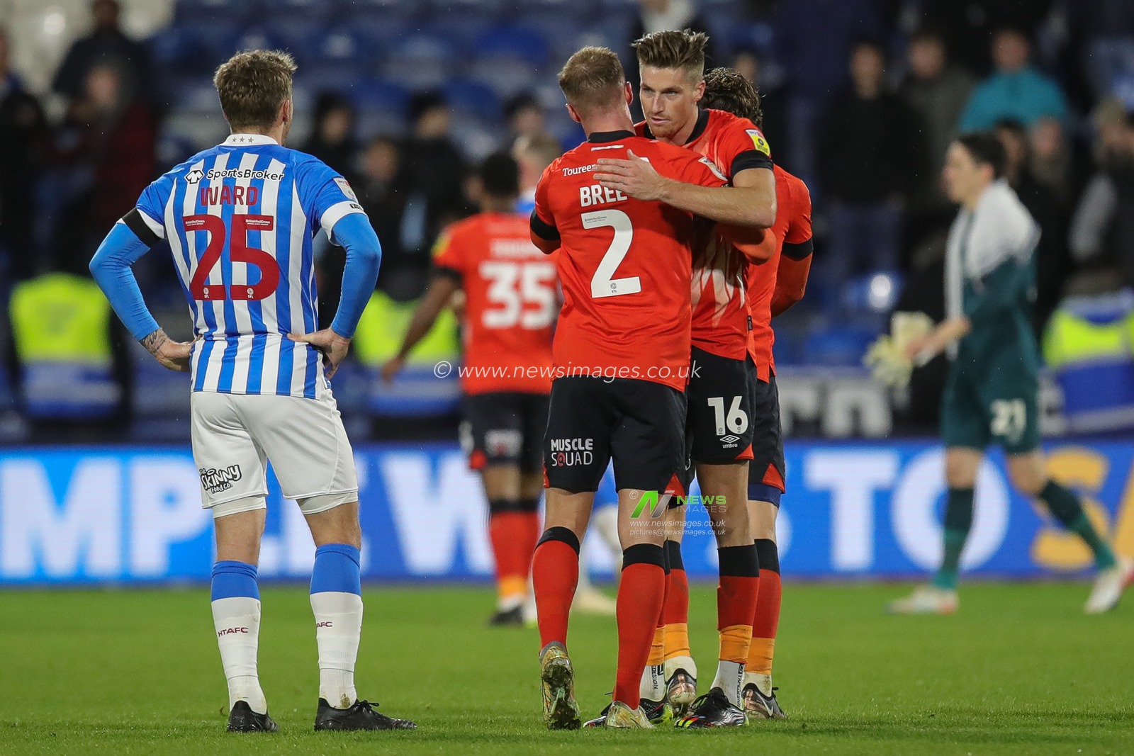 Goalscorer Reece Burke #16 of Luton Town hugs team mate James Bree after beating Huddersfield in the Sky Bet Championship match Huddersfield Town vs Luton Town at John Smith's Stadium, Huddersfield, United Kingdom, 1st January 2023

(Photo by James Heaton/News Images)
