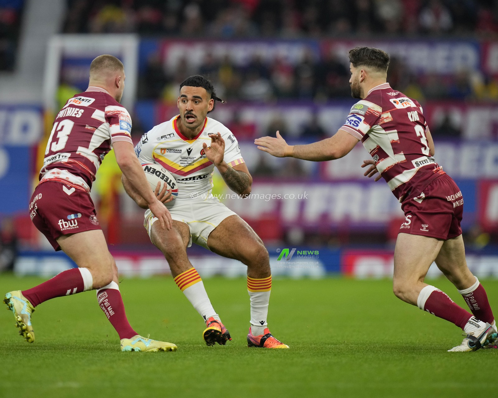 Tyrone May #6 of Catalans Dragons runs at the Wigan Warriors defence during the Betfred Super League Grand Final match Wigan Warriors vs Catalans Dragons at Old Trafford, Manchester, United Kingdom, 14th October 2023

(Photo by Steve Flynn/News Images)