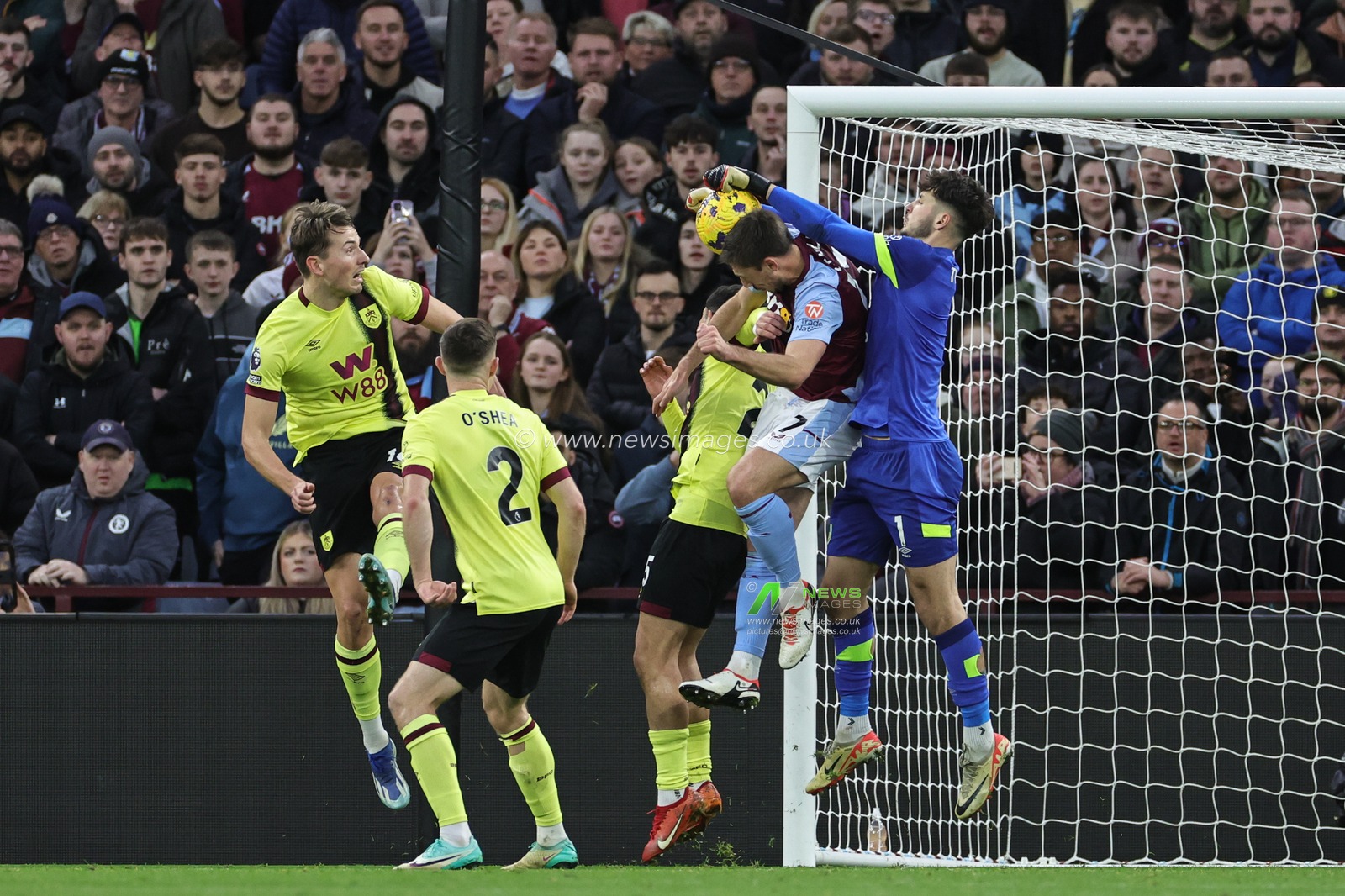James Trafford of Burnley clashes with ClÃ©ment Lenglet of Aston Villa as he punches the ball away during the Premier League match Aston Villa vs Burnley at Villa Park, Birmingham, United Kingdom, 30th December 2023

(Photo by Mark Cosgrove/News Images)