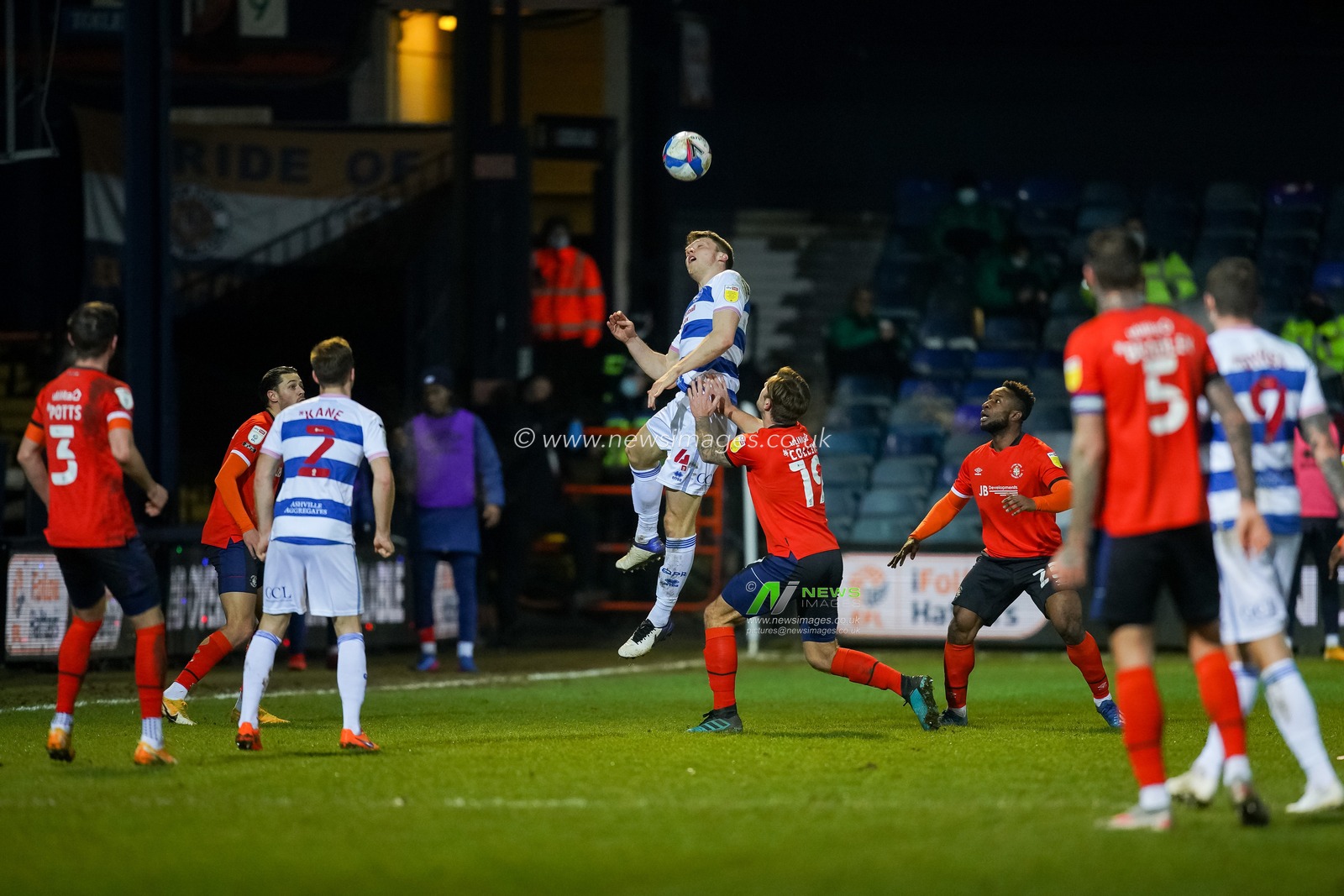 Rob Dickie #4 of Queens Park Rangers winds the ball
