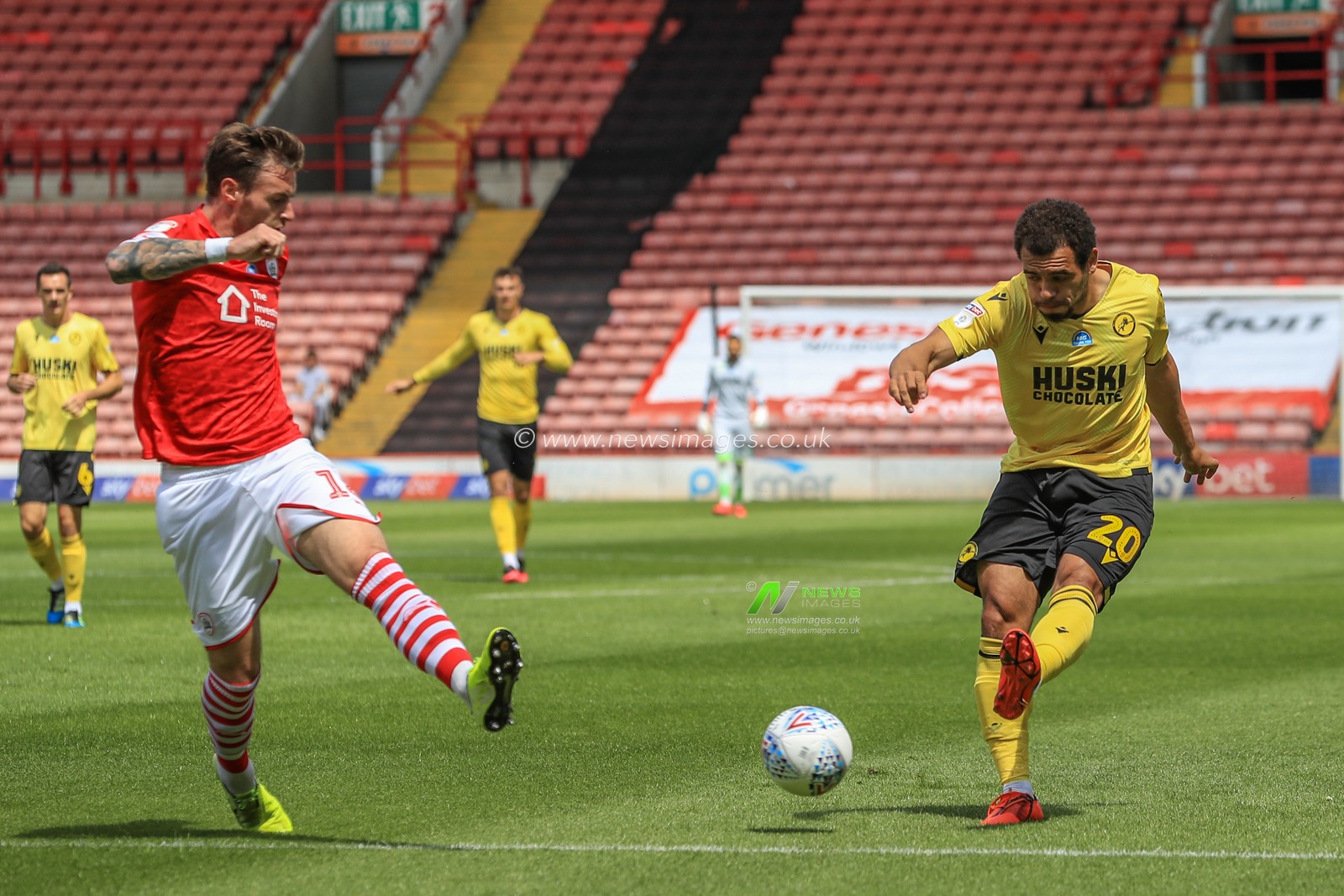 Mason Bennett (20) of Millwall crosses the ball
