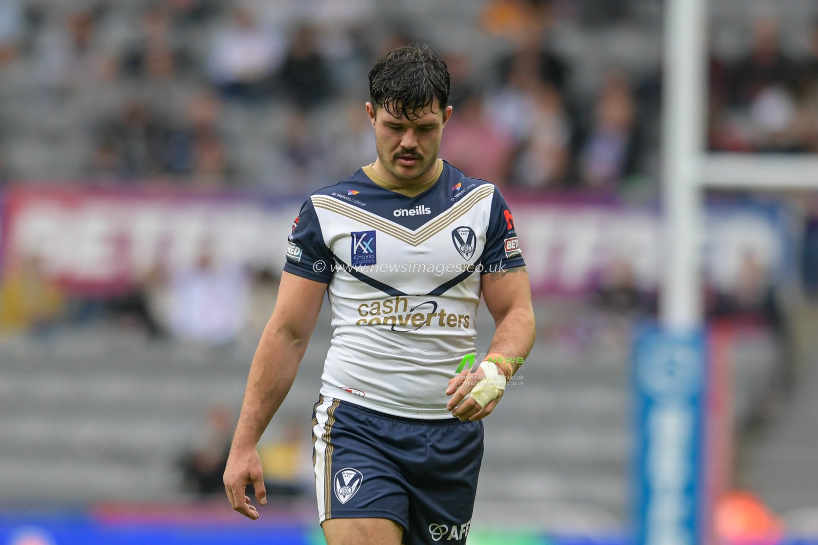 James Bentley (12) of St Helens looks down at the ground