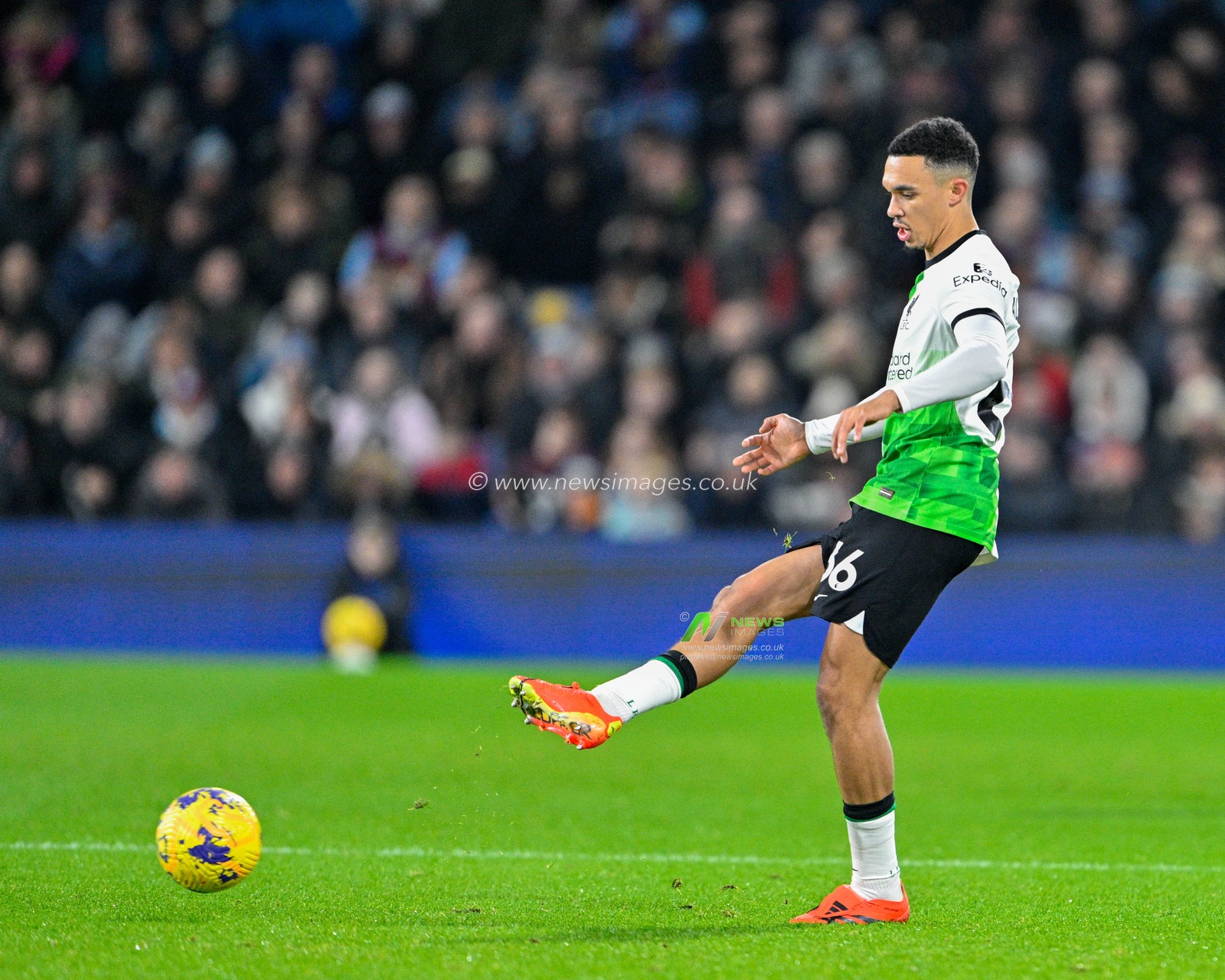 Trent Alexander-Arnold 66# of Liverpool Football Club passes the ball, during the Premier League match Burnley vs Liverpool at Turf Moor, Burnley, United Kingdom, 26th December 2023

(Photo by Cody Froggatt/News Images)