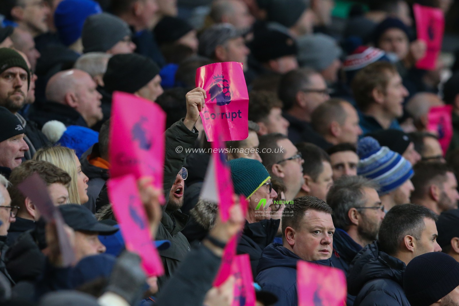 Everton fans hold up Premier League Corrupt signs during the Premier League match Wolverhampton Wanderers vs Everton at Molineux, Wolverhampton, United Kingdom, 30th December 2023

(Photo by Gareth Evans/News Images)