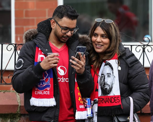 Manchester United fans on their way to Old Trafford during the Premier League match Manchester United vs Crystal Palace at Old Trafford, Manchester, United Kingdom on 01 March 2026

(Photo by Mark Cosgrove/News Images)