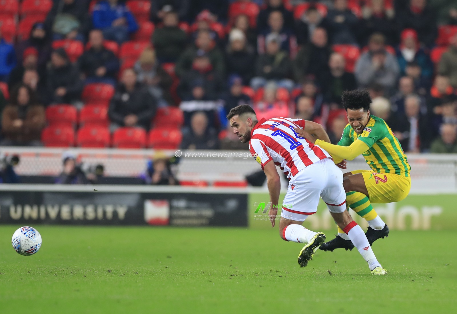4th November 2019, Bet365 Stadium, Stoke-on-Trent, England; Sky Bet Championship, Stoke City v West Bromwich Albion : Matheus Pereira (12) of West Bromwich Albion and Tommy Smith (14) of Stoke City clash in the tackle

Credit: Conor Molloy/News Images