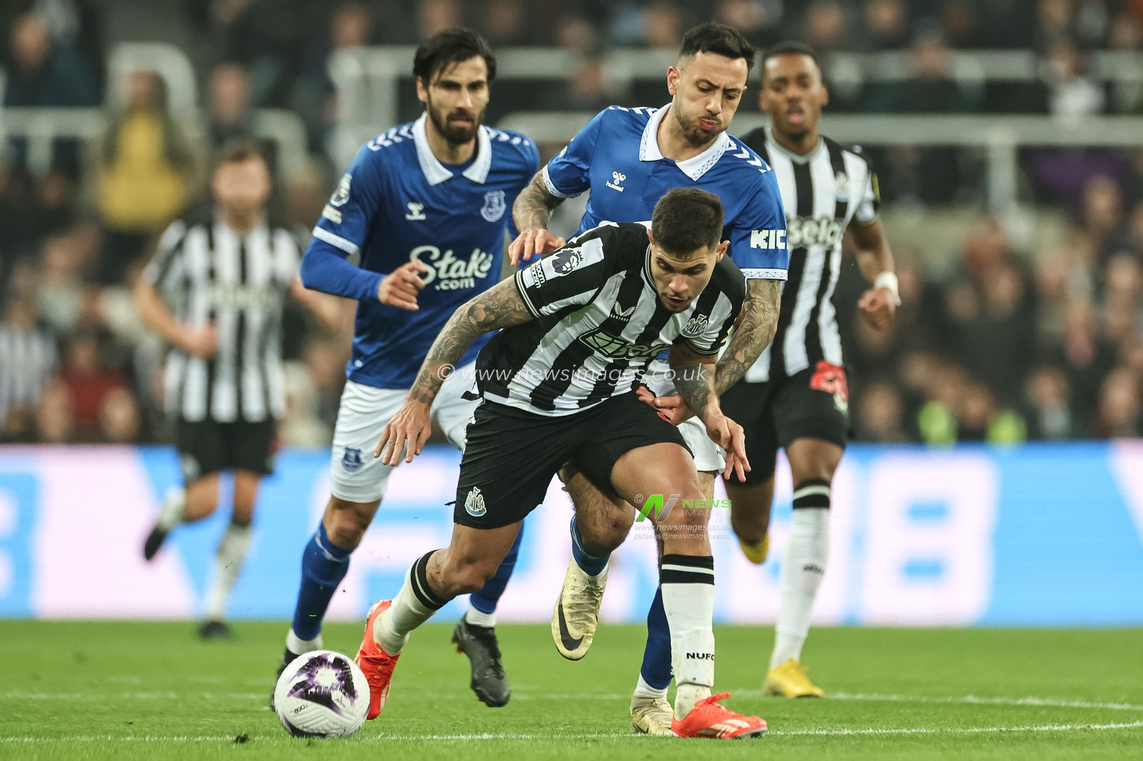 Bruno GuimarÃ£es of Newcastle United is fouled by Dwight McNeil of Everton during the Premier League match Newcastle United vs Everton at St. James's Park, Newcastle, United Kingdom, 2nd April 2024

(Photo by Mark Cosgrove/News Images)