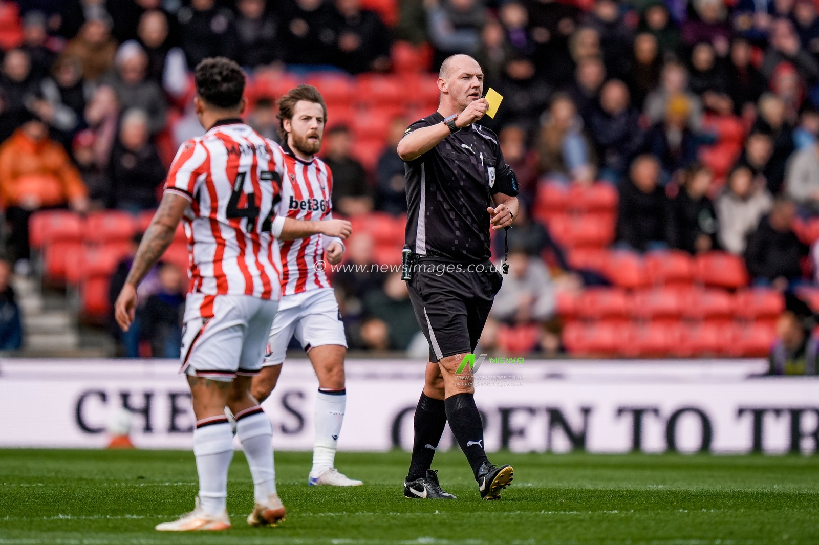 Referee ROBERT MADLEY gives a yellow card to Moussa Baradji of Blackburn Rovers   during the Sky Bet Championship match Stoke City vs Blackburn Rovers at Bet365 Stadium, Stoke On Trent, United Kingdom on 11 April 2026

(Photo by Maynard Manyowa/News Images)