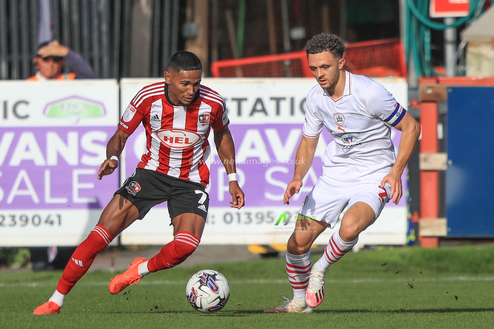 Demi Mitchell #7 of Exeter City breaks with the ball as Jordan Williams #2 of Barnsley pressures during the Sky Bet League 1 match Exeter City vs Barnsley at St James' Park, Exeter, United Kingdom, 7th October 2023

(Photo by Alfie Cosgrove/News Images)